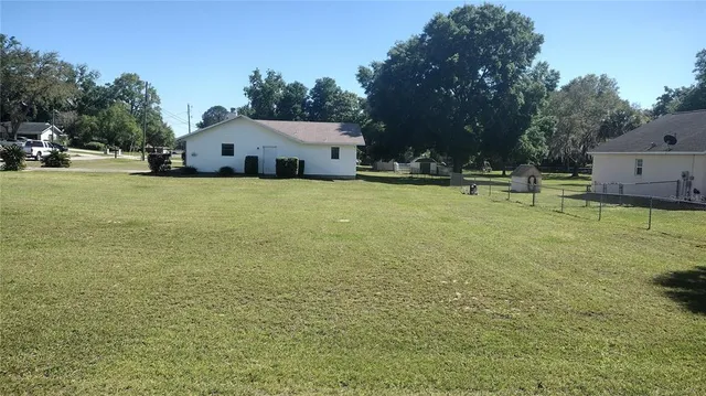 a house view with swimming pool in front of it