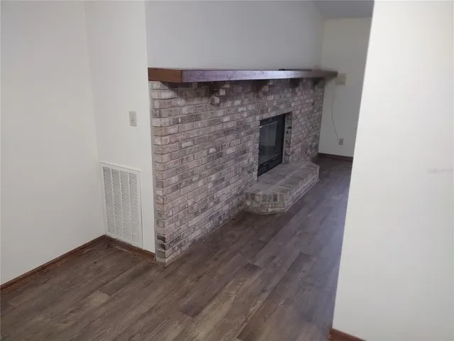 a view of front door with wooden floor