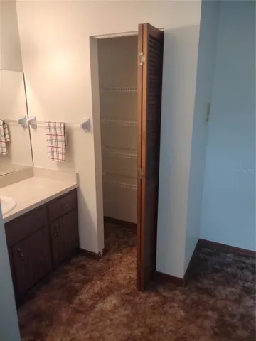 a bathroom with a sink and mirror
