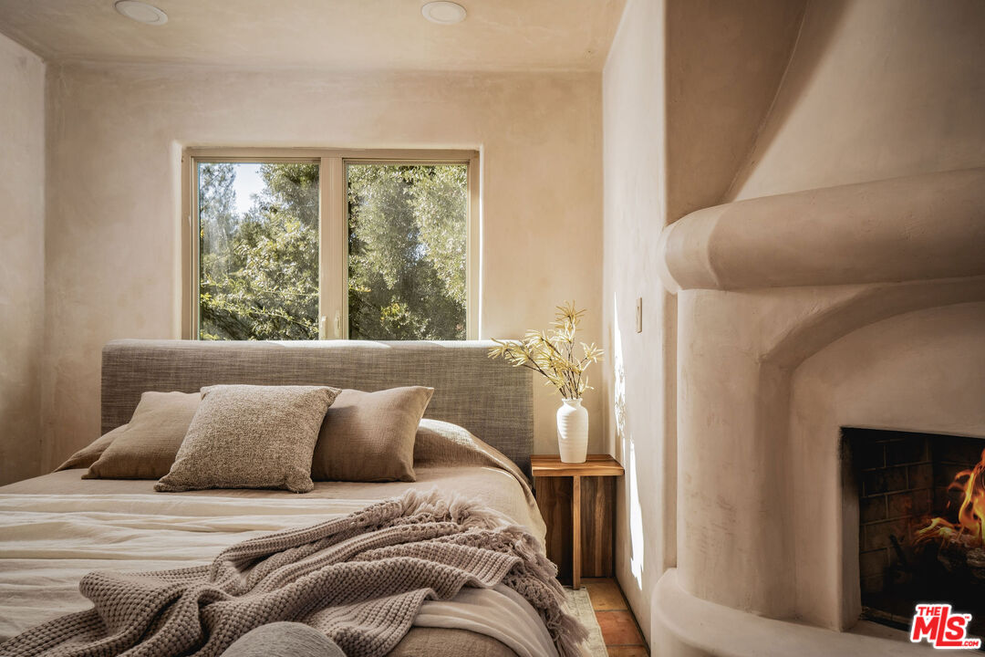 3450 Thacher Road Ojai, CA 93023 - Photo 13 of 33 a bed sitting in a bedroom next to a window