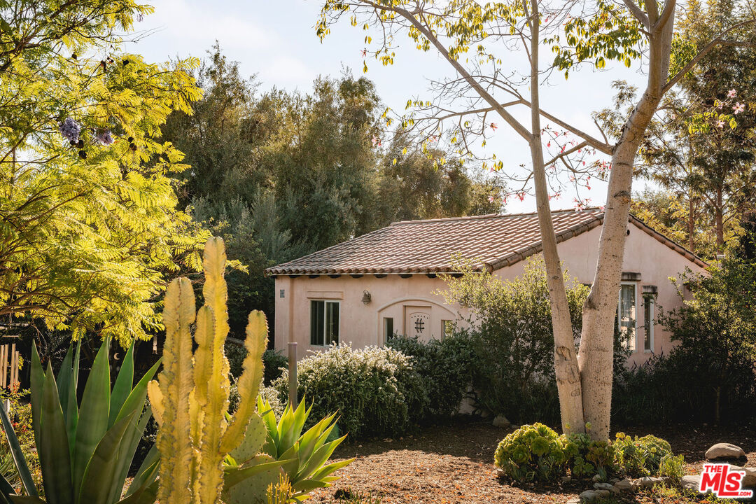 3450 Thacher Road Ojai, CA 93023 - Photo 16 of 33 a view of a house with a tree and a yard