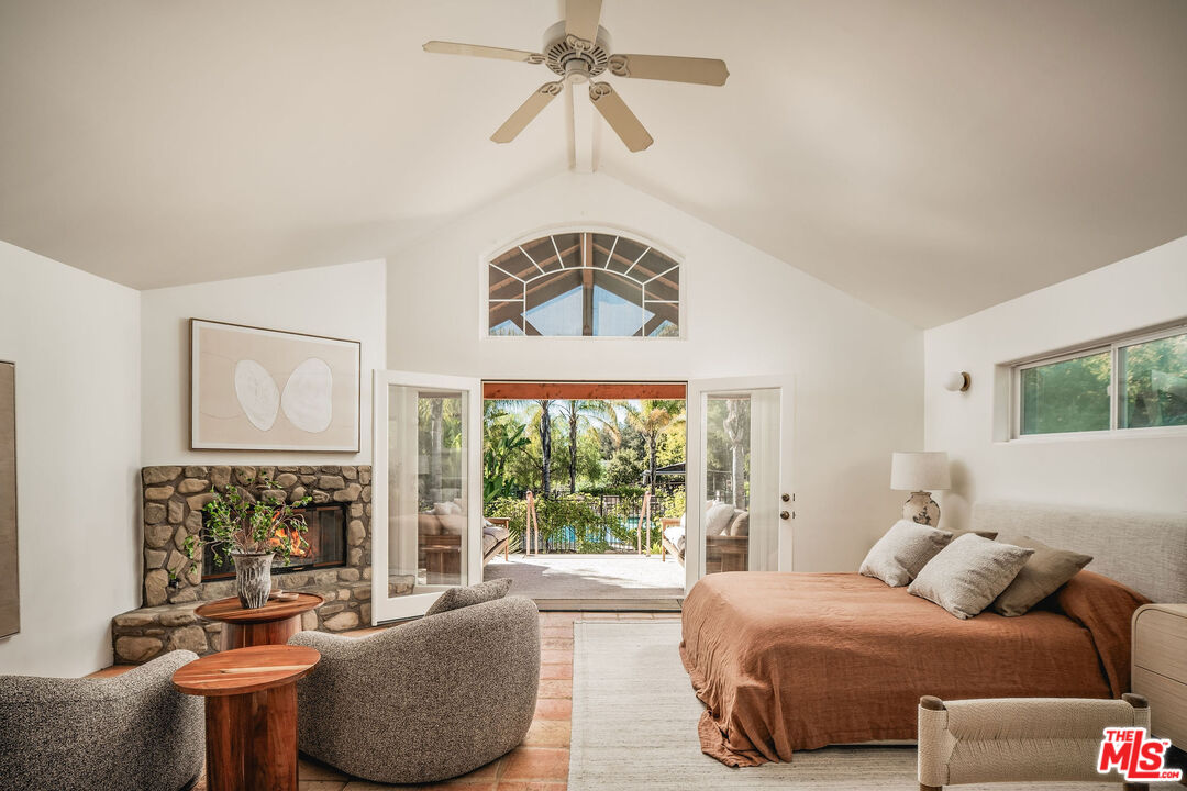 3450 Thacher Road Ojai, CA 93023 - Photo 22 of 33 a bedroom with a bed and a chandelier