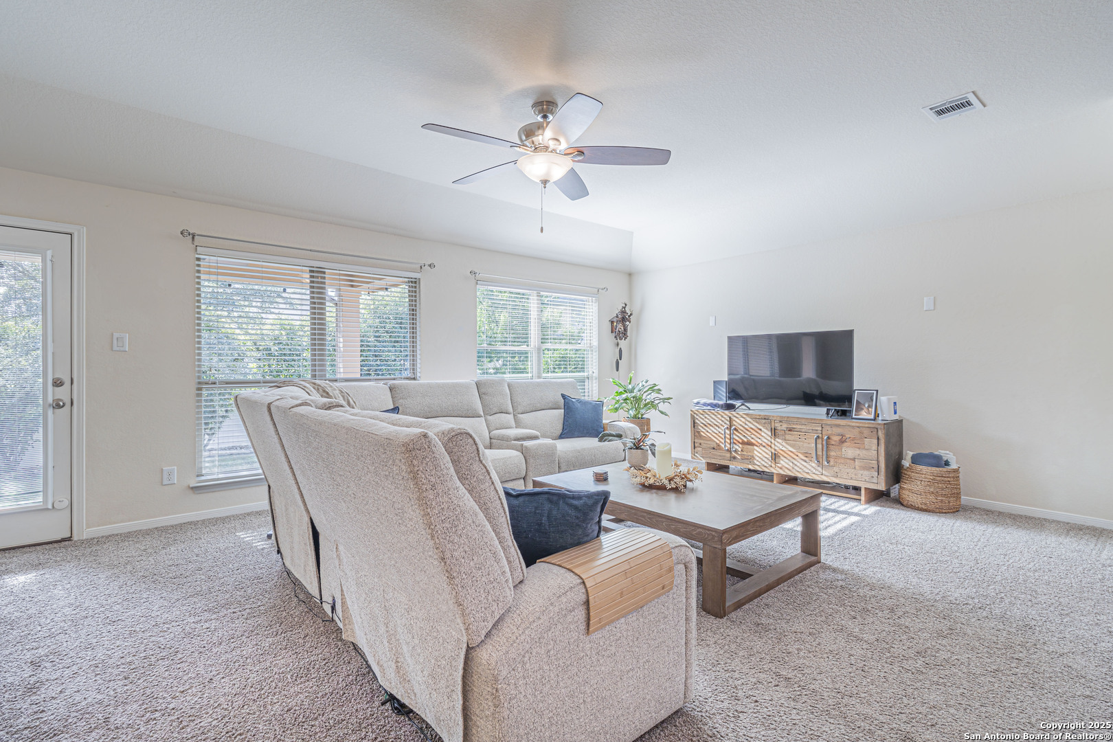 159 Brook View Cibolo, TX 78108 - Photo 12 of 24 a living room with furniture and a flat screen tv