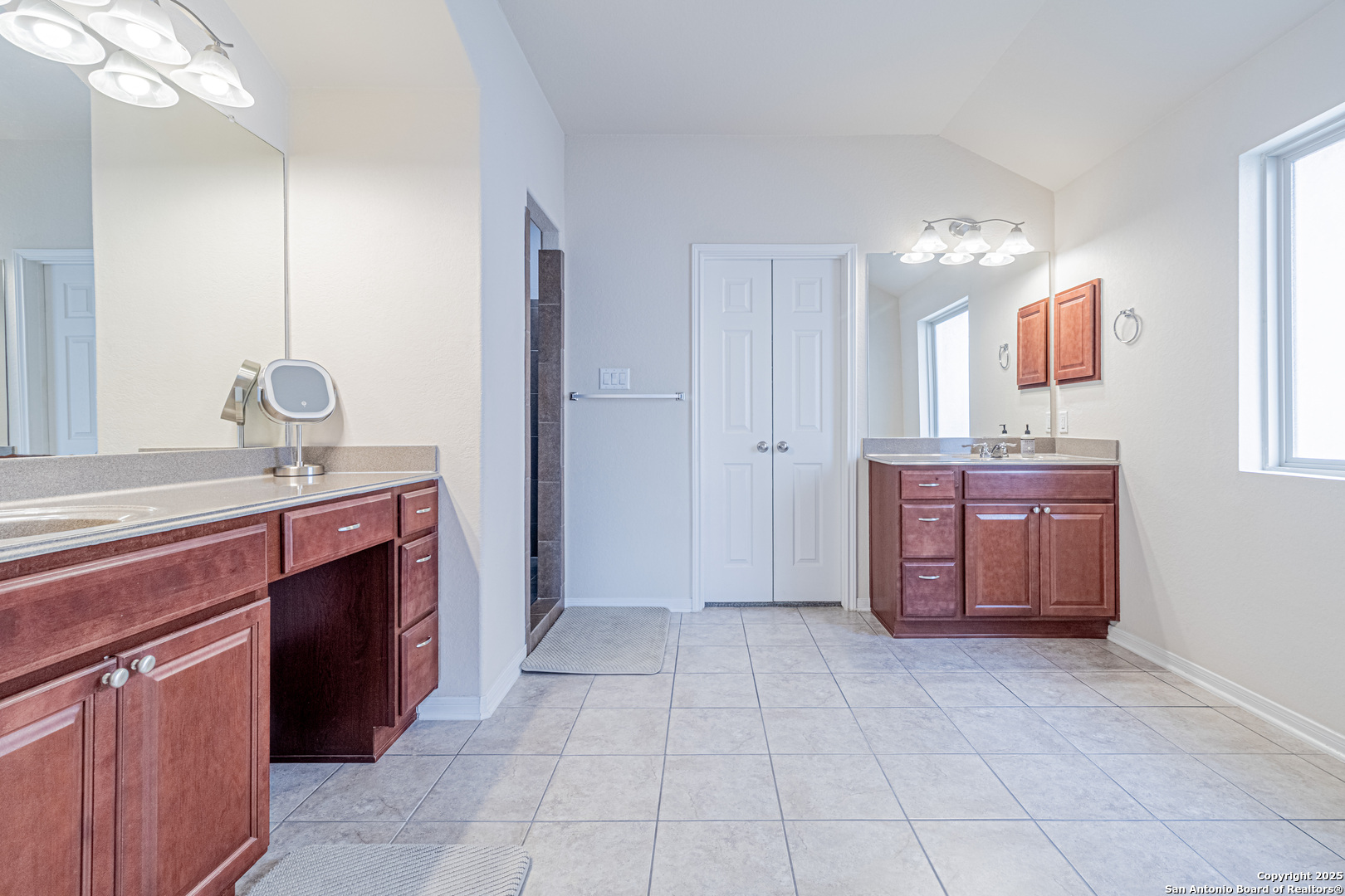 159 Brook View Cibolo, TX 78108 - Photo 15 of 24 a spacious bathroom with a sink and a mirror