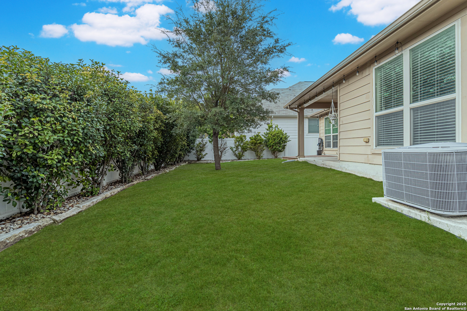 159 Brook View Cibolo, TX 78108 - Photo 24 of 24 a view of a backyard with a garden