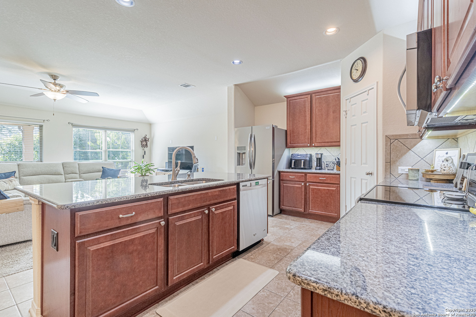 159 Brook View Cibolo, TX 78108 - Photo 5 of 24 a kitchen with stainless steel appliances granite countertop a sink and a stove