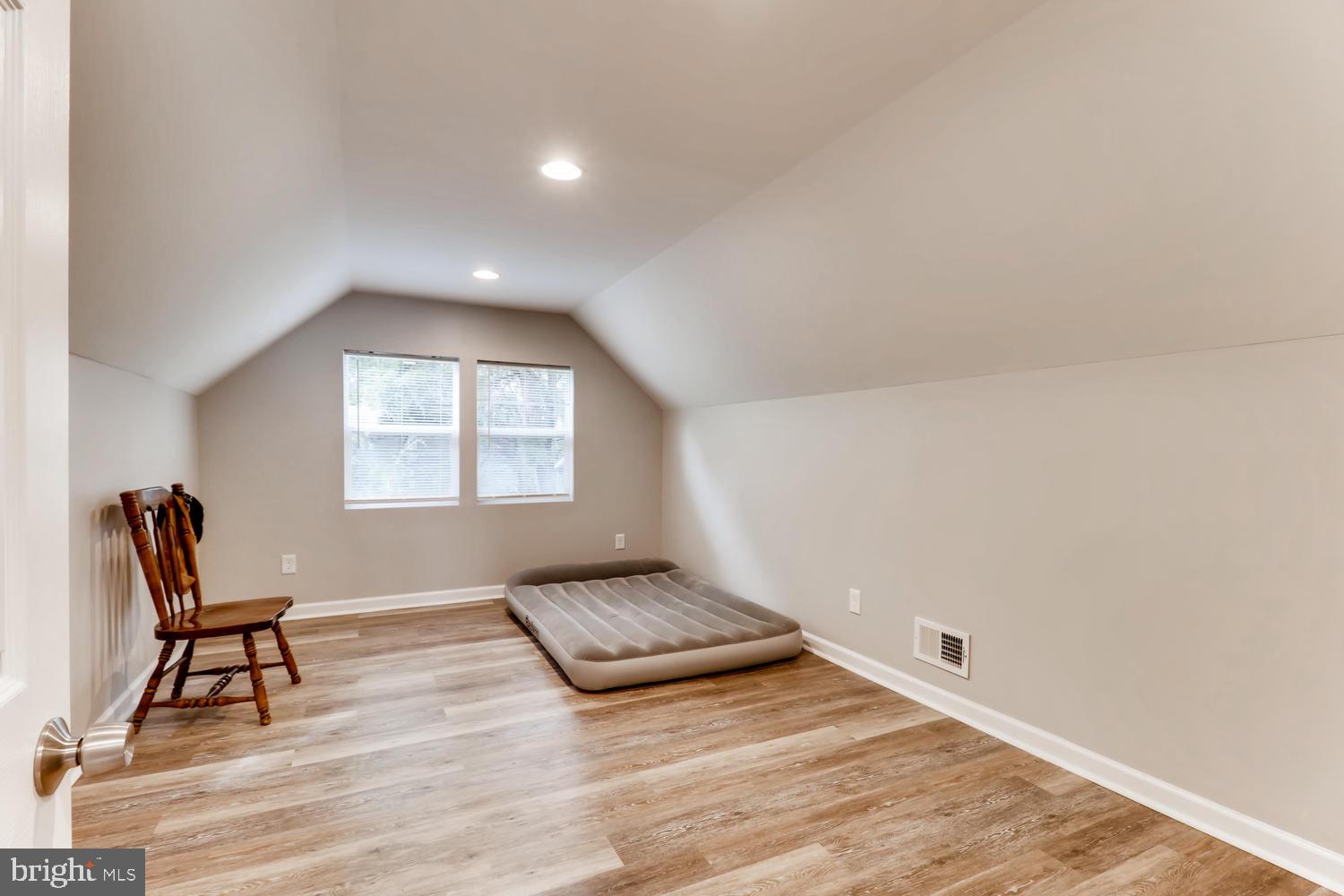 3413 Kimble Road Windsor Mill, MD 21244 - Photo 18 of 28 a view of an empty room and wooden floor