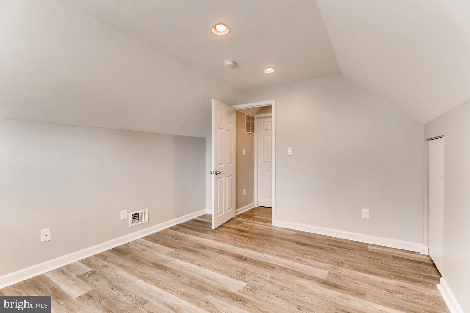 3413 Kimble Road Windsor Mill, MD 21244 - Photo 22 of 28 a view of a livingroom with wooden floor