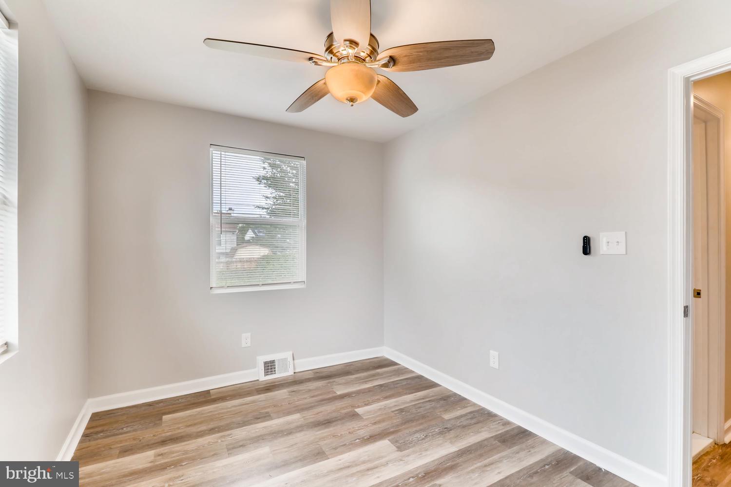 3413 Kimble Road Windsor Mill, MD 21244 - Photo 10 of 28 a view of a room with a window and a ceiling fan
