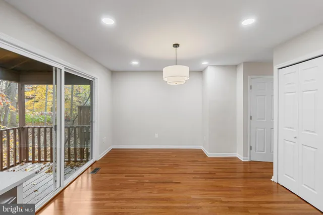 a view of a room with wooden floor and iron gate