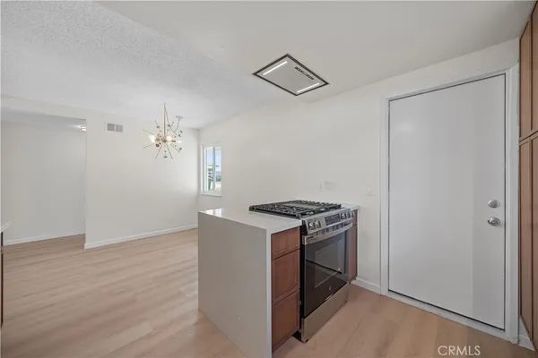 a kitchen that has a stove and a refrigerator