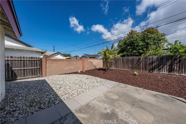 a view of a backyard of the house
