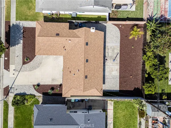 an aerial view of a house with a yard