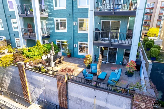 a front view of a house with outdoor seating