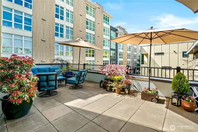 a group of people sitting in front of a cafe