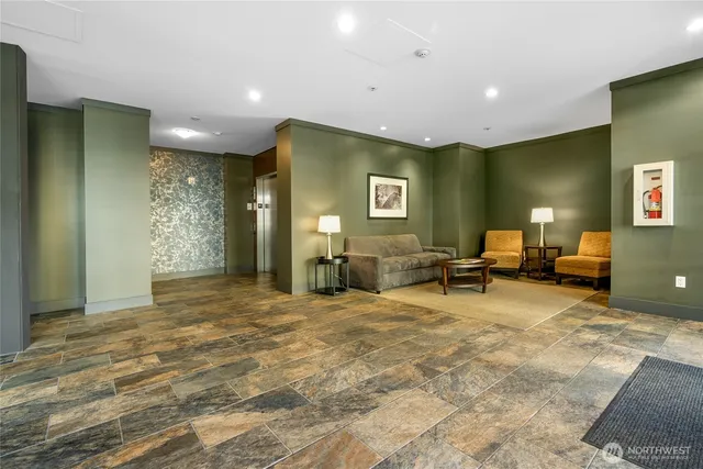 a view of a livingroom with furniture and a flat screen tv