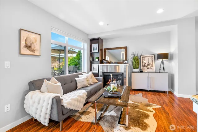 a living room with furniture and a large window