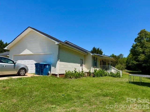 4084 Carpenters Cove Road Claremont, NC 28610 - Photo 3 of 27 a view of a house with backyard