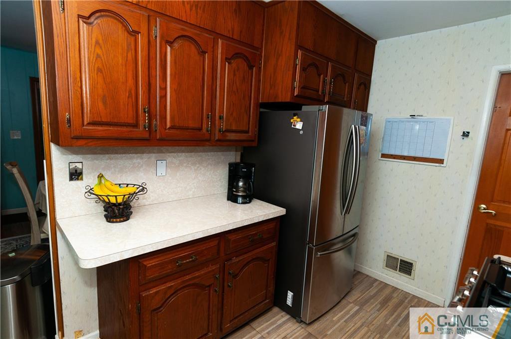 18 Rutgers Road Old Bridge, NJ 08859 - Photo 11 of 30 a kitchen with stainless steel appliances a refrigerator and a sink