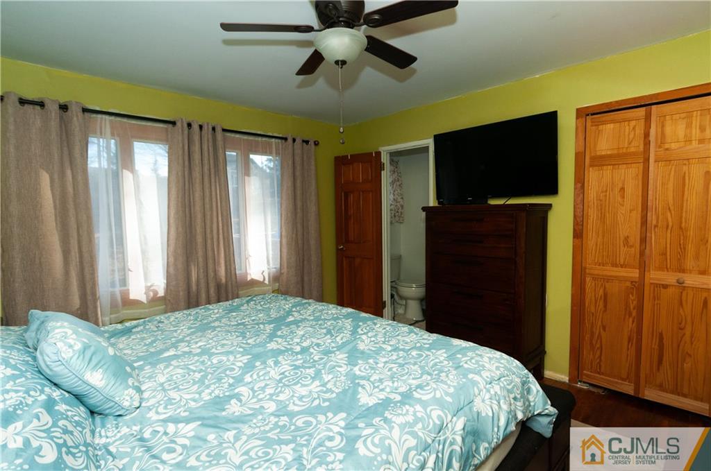 18 Rutgers Road Old Bridge, NJ 08859 - Photo 13 of 30 a bedroom with a bed and a flat tv screen