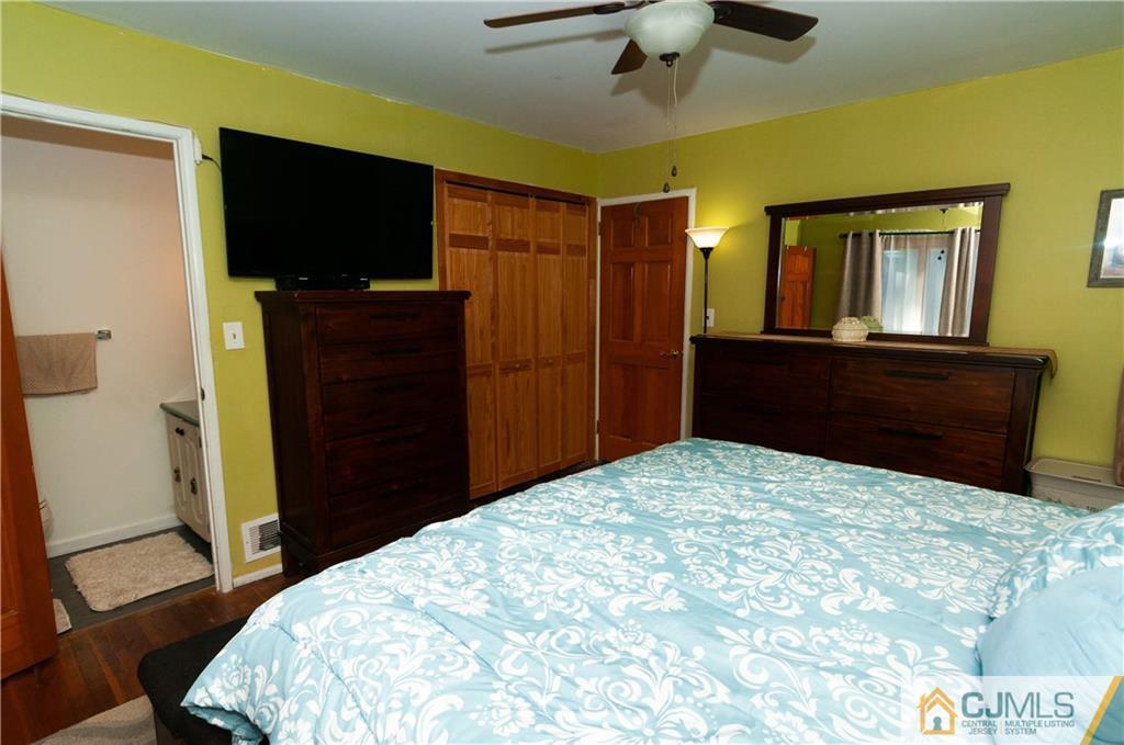 18 Rutgers Road Old Bridge, NJ 08859 - Photo 14 of 30 a bedroom with a bed and a flat tv screen on dresser