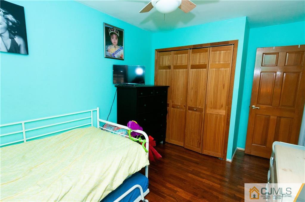 18 Rutgers Road Old Bridge, NJ 08859 - Photo 17 of 30 a bedroom with a bed and wooden floor