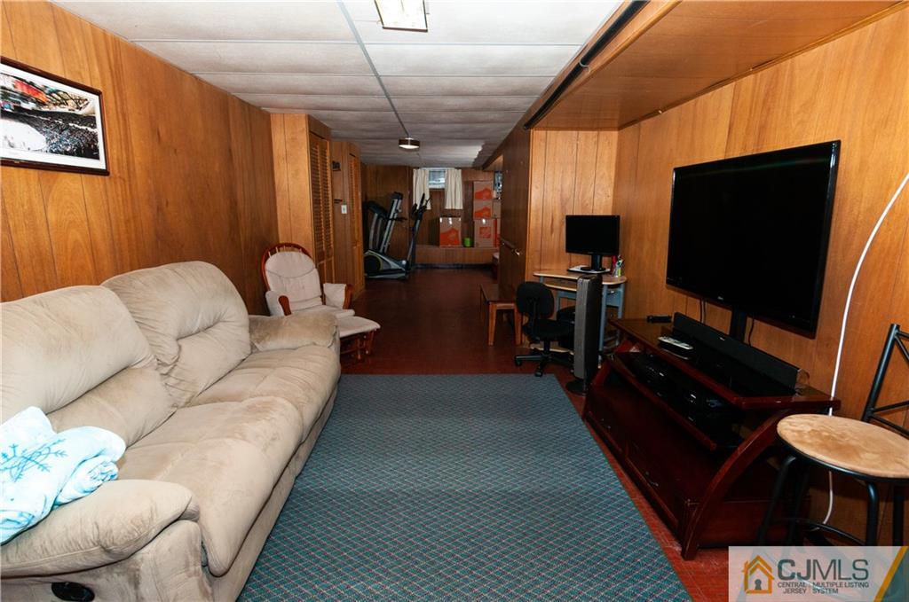 18 Rutgers Road Old Bridge, NJ 08859 - Photo 21 of 30 a living room with furniture and a flat screen tv
