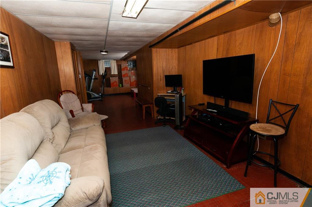 18 Rutgers Road Old Bridge, NJ 08859 - Photo 22 of 30 a living room with furniture and a flat screen tv