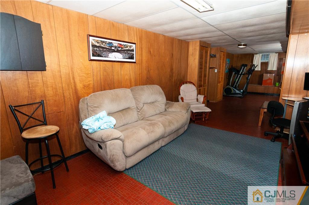 18 Rutgers Road Old Bridge, NJ 08859 - Photo 23 of 30 a living room with furniture and a potted plant