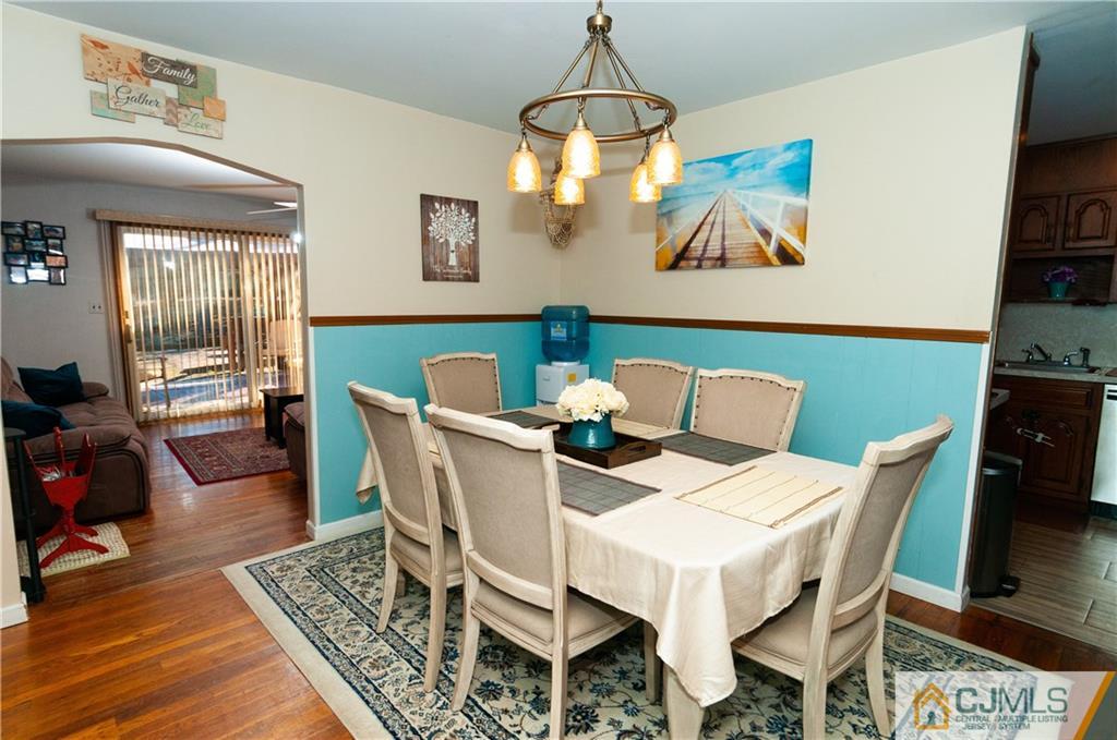 18 Rutgers Road Old Bridge, NJ 08859 - Photo 5 of 30 a dining room with furniture a rug and wooden floor