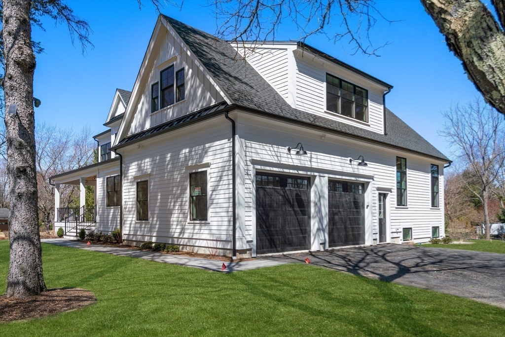 81 Powers Road Concord, MA 01742 - Photo 9 of 10 a front view of a house with a yard