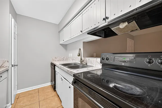 a kitchen with a stove and a microwave