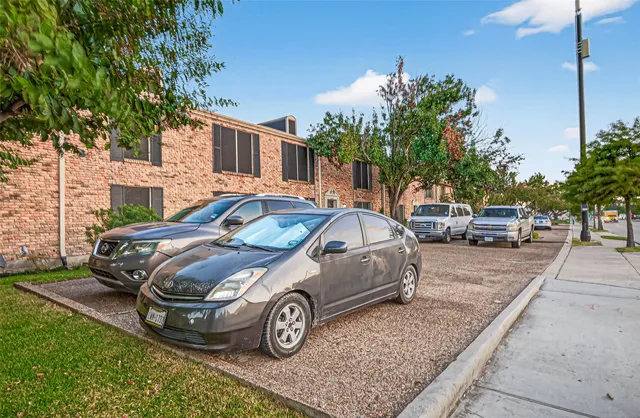 a front view of a house with parking space