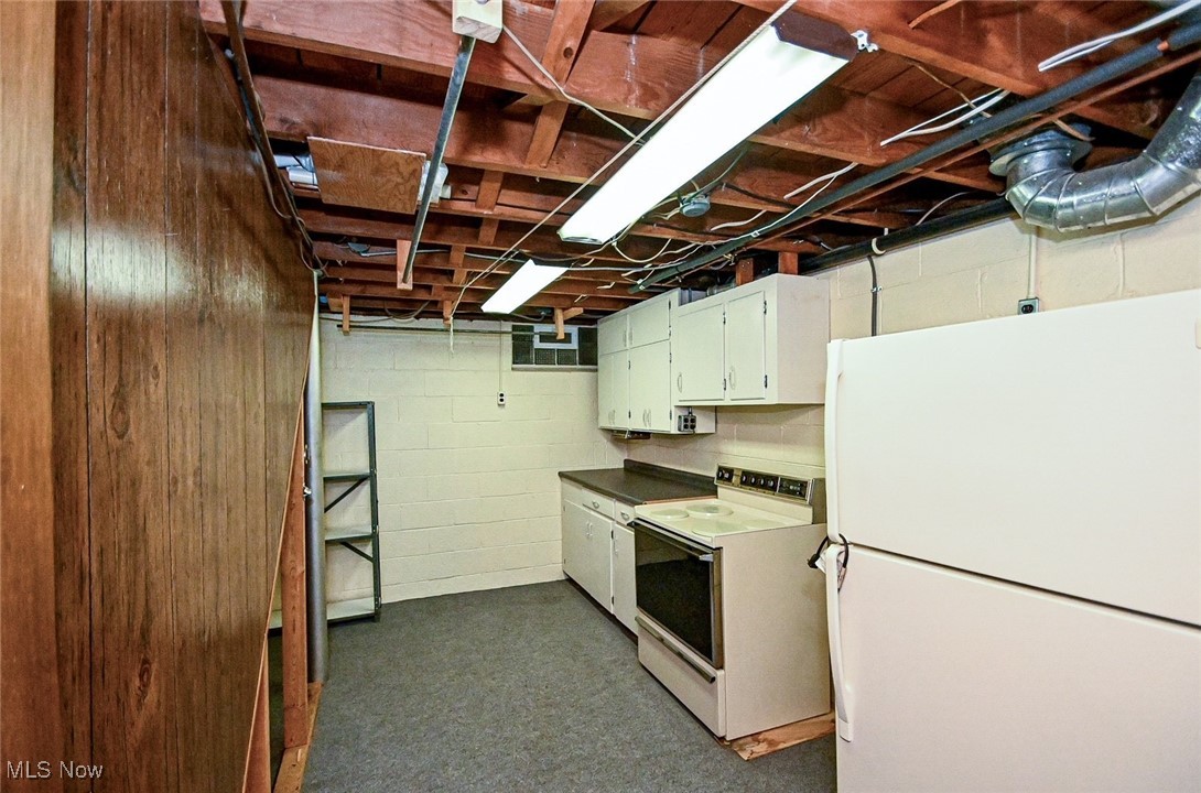 4858 Arbor Road Southwest Canton, OH 44710 - Photo 31 of 31 Basement with white refrigerator