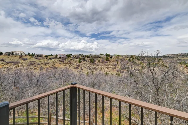a view of an entryway with wooden floor and door