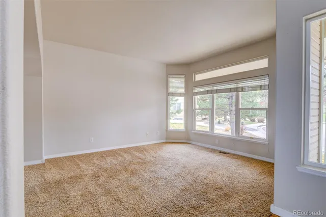 a kitchen with stainless steel appliances granite countertop a stove a microwave and a refrigerator