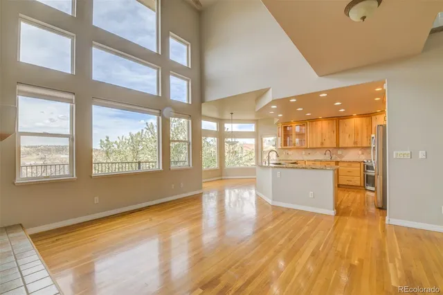 a bathroom with a tub sink shower and mirror