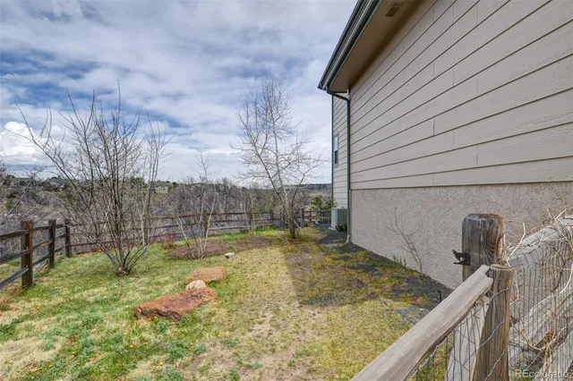 a view of a roof deck with wooden floor