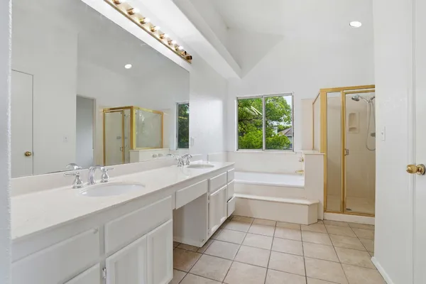 a bathroom with a bathtub and a shower