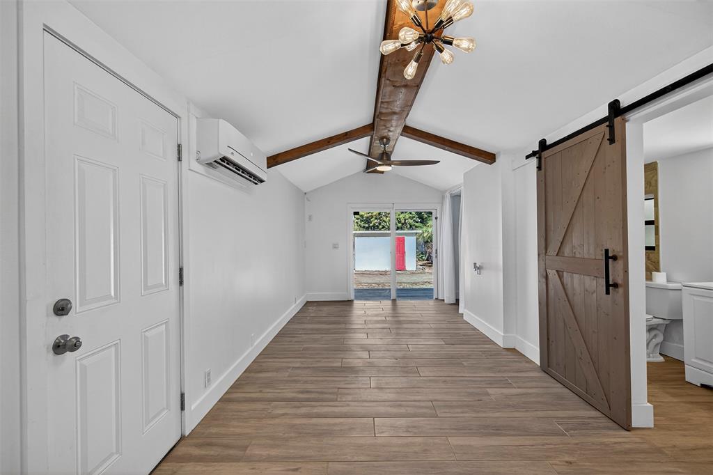 181 Northeast 15th Terrace Boca Raton, FL 33431 - Photo 11 of 51 a view of a hallway with wooden floor and staircase