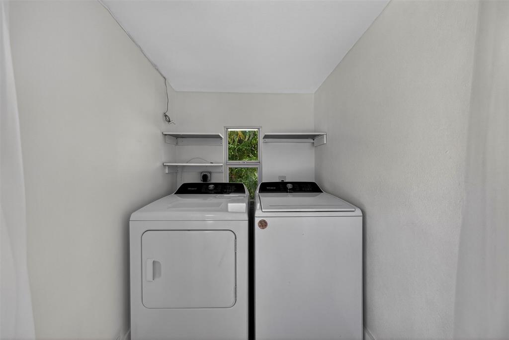 181 Northeast 15th Terrace Boca Raton, FL 33431 - Photo 17 of 51 a utility room with dryer and washer