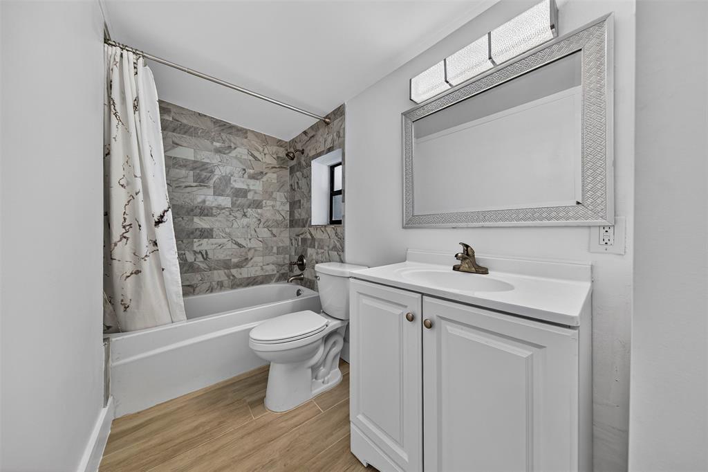 181 Northeast 15th Terrace Boca Raton, FL 33431 - Photo 19 of 51 a bathroom with a sink a toilet and shower