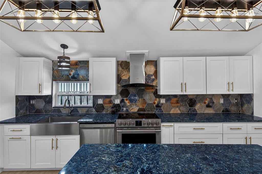 181 Northeast 15th Terrace Boca Raton, FL 33431 - Photo 29 of 51 a kitchen with a refrigerator and cabinets