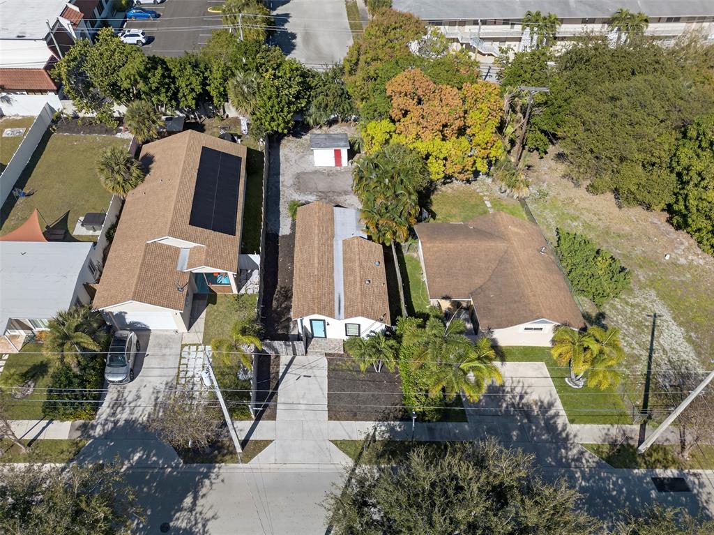 181 Northeast 15th Terrace Boca Raton, FL 33431 - Photo 3 of 51 an aerial view of a house with a yard and a fountain