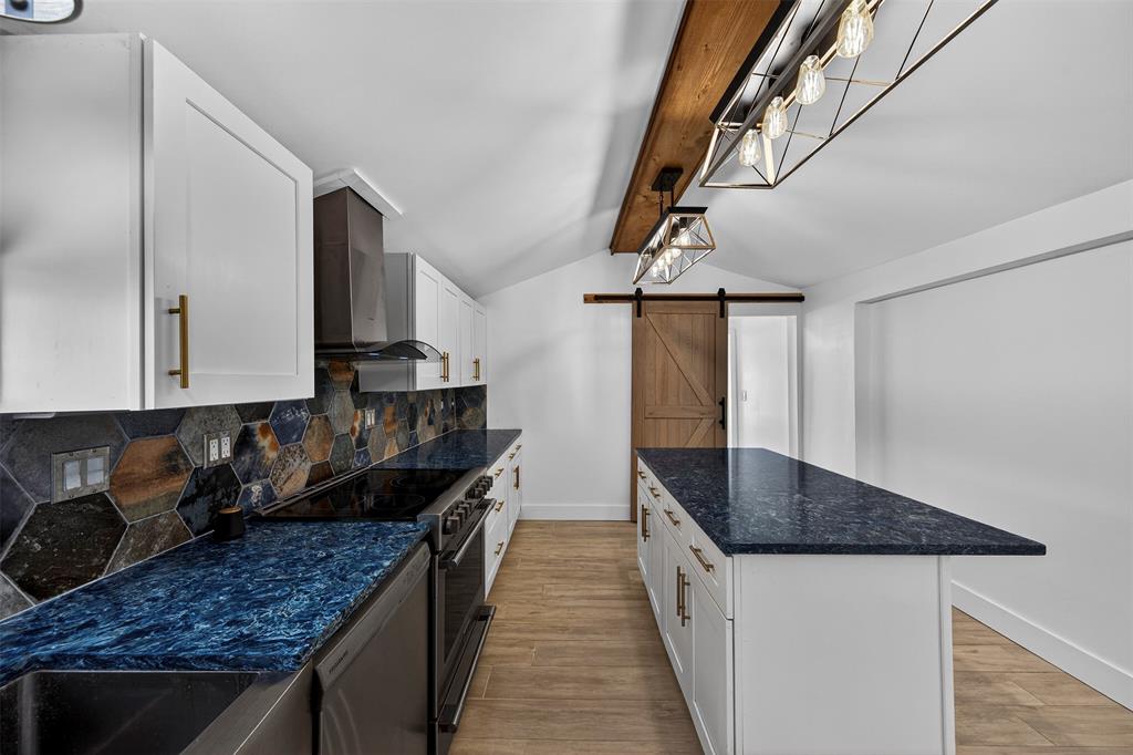 181 Northeast 15th Terrace Boca Raton, FL 33431 - Photo 32 of 51 a kitchen with granite countertop a sink a stove and cabinets