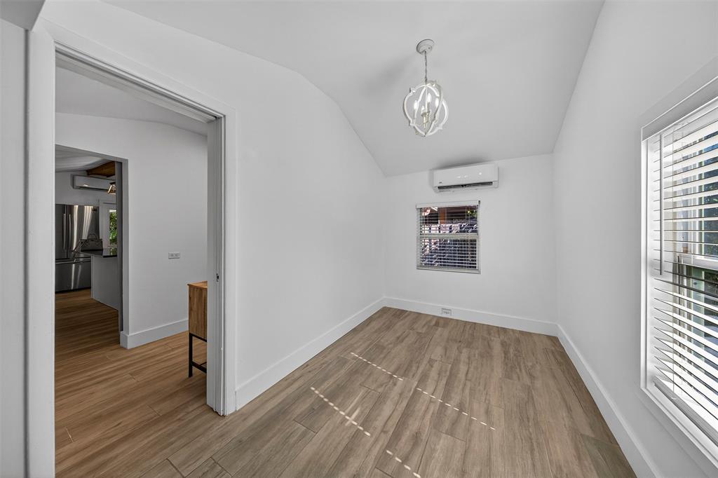 181 Northeast 15th Terrace Boca Raton, FL 33431 - Photo 37 of 51 wooden floor in an empty room with a window