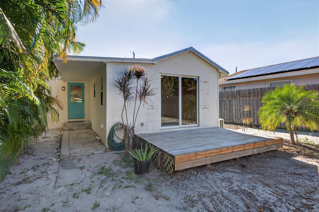 181 Northeast 15th Terrace Boca Raton, FL 33431 - Photo 49 of 51 a view of house with backyard and outdoor seating