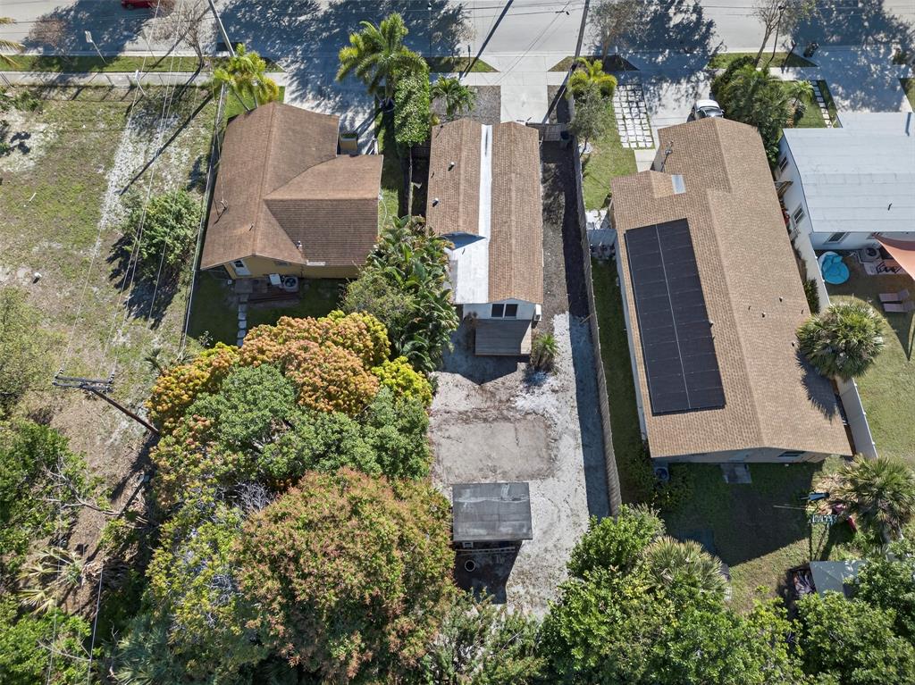 181 Northeast 15th Terrace Boca Raton, FL 33431 - Photo 5 of 51 an aerial view of a house with a yard and large trees