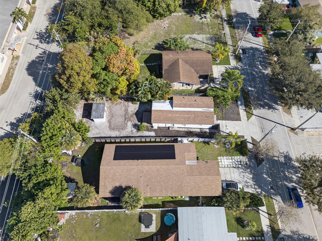 181 Northeast 15th Terrace Boca Raton, FL 33431 - Photo 6 of 51 an aerial view of house with yard swimming pool and outdoor seating