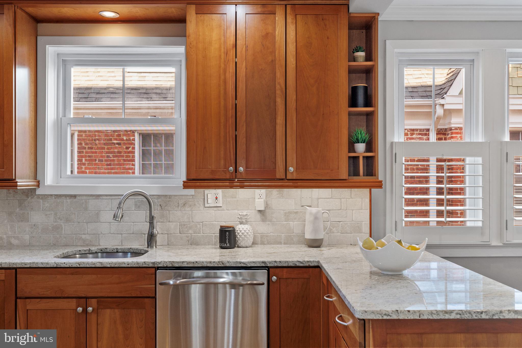 202 Russell Road Alexandria, VA 22301 - Photo 21 of 70 a kitchen with granite countertop cabinets sink and window